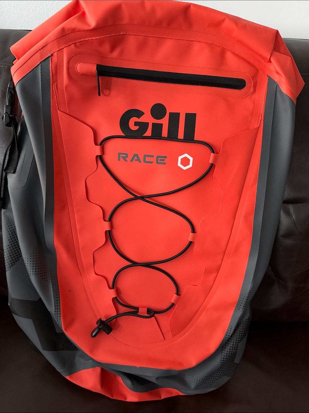 Gill Race Waterproof Backpack in Orange/Red